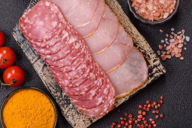 istock Delicious fresh smoked sausages cut with slices 2189814944