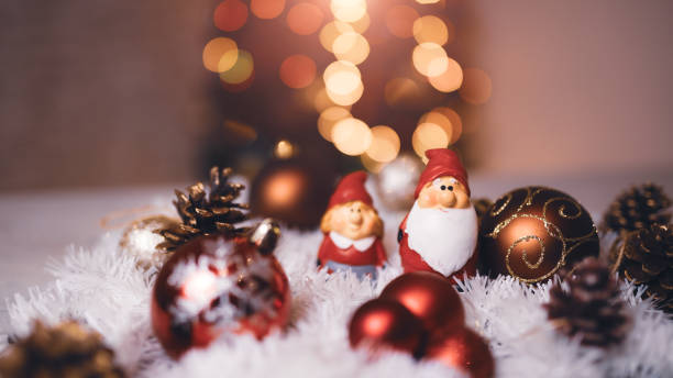 istock Festive Christmas Decorations Featuring Santa Figures and Baubles with Bright Bokeh Lights 2189817199