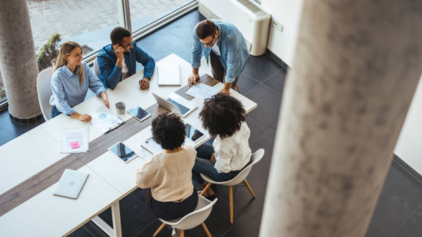istock Diverse Team Collaborating in Modern Office Meeting 2189818177