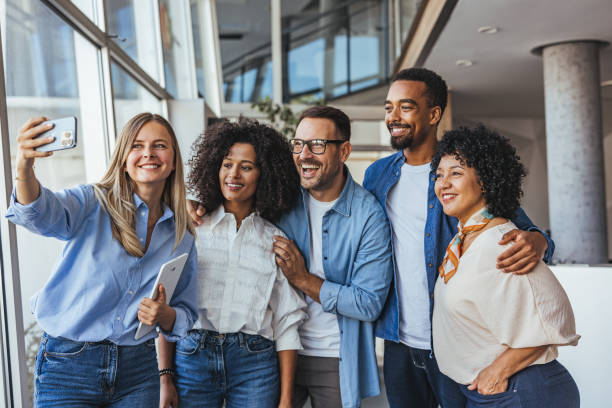 istock Group of Diverse Colleagues Taking a Joyful Selfie Together 2189818183