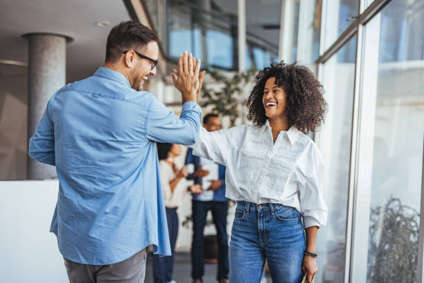 istock Joyful Business Colleagues Celebrating Success With High Five 2189818206