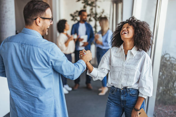 istock Joyful Business Colleagues Celebrating Success in Modern Office 2189818221
