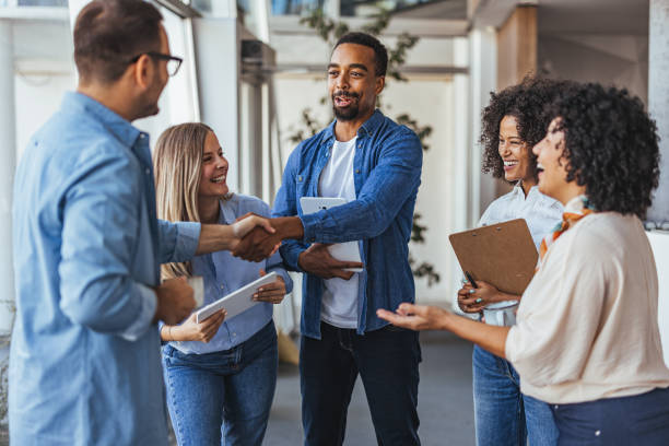 istock Diverse Team Engaged in a Friendly Business Meeting Interaction 2189818222
