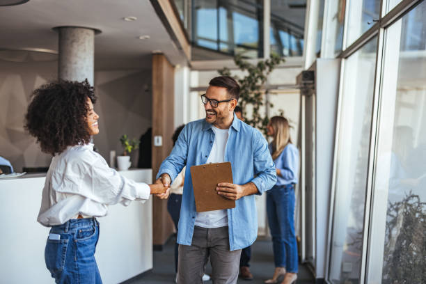 istock Friendly Business Meeting With Handshake in Modern Office 2189818230