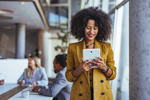 istock Confident Businesswoman Using Tablet in Modern Office Environment 2189818251