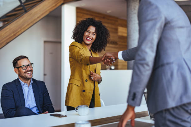 istock Business Professionals Shaking Hands in a Modern Office 2189818252