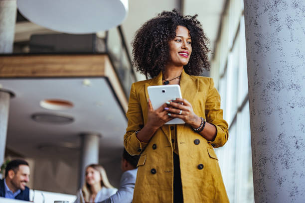 istock Confident Businesswoman Holding Tablet in Modern Office 2189818263