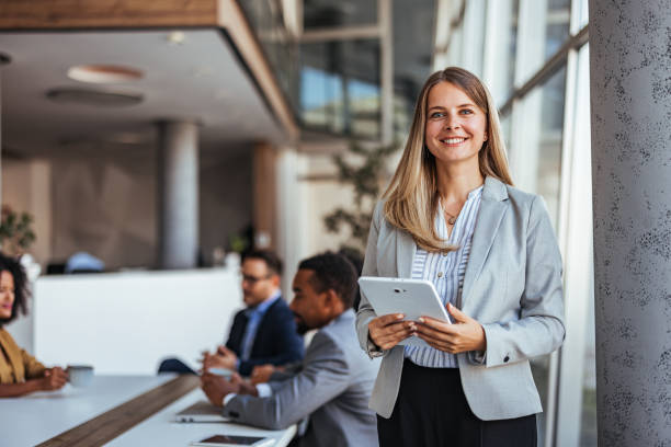 istock Confident Businesswoman Holding a Tablet in Modern Office 2189818290
