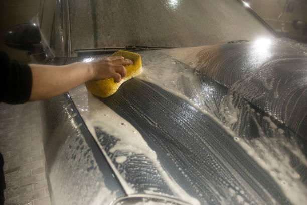 Washing foam from the car. Car wash. Soap solution on the surface. Transport at the car wash.