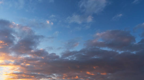 istock Sunset sky background. Beautiful evening sunset sky with clouds. 2189818995
