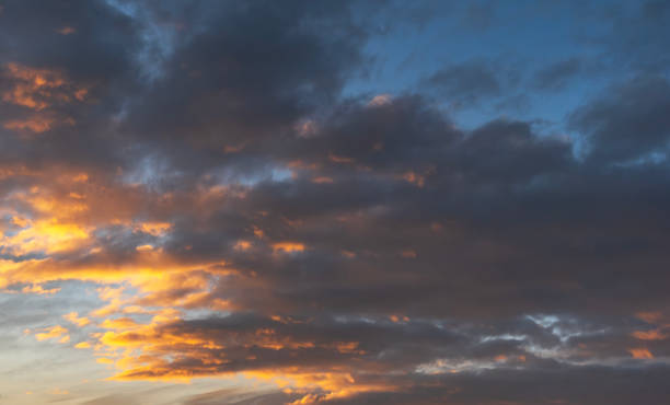 istock Sunset sky background. Beautiful evening sunset sky with clouds. 2189818996