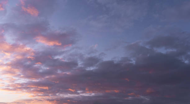 istock Sunset sky background. Beautiful evening sunset sky with clouds. 2189819055