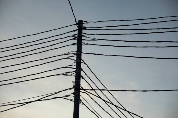 Wires against sky. Lots of electrical wires. Electric transmission lines.