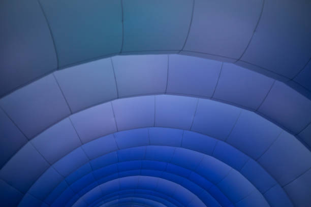 Burner flame heating a blue balloon from the basket