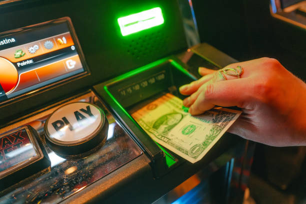 istock Casino Slot Machine - Play Button - Close Up - Hand 2189821689