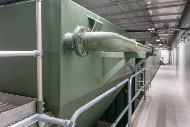 istock Plastic pipes inside a new small waste water treatment plant. 2189821779