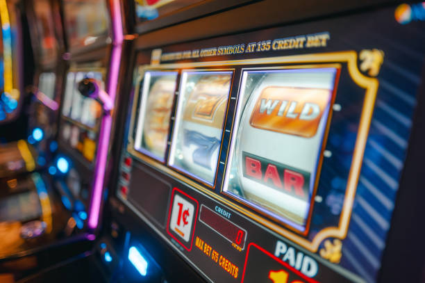 istock Casino Slot Machine - Play Button - Close Up - One Cent to Play 2189821979