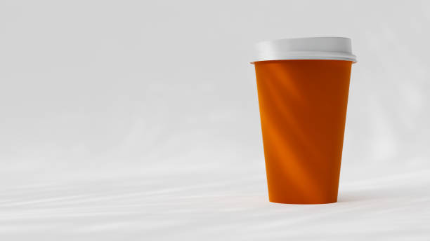 Conceptual shot with paper coffee cup and related words on orange colored background