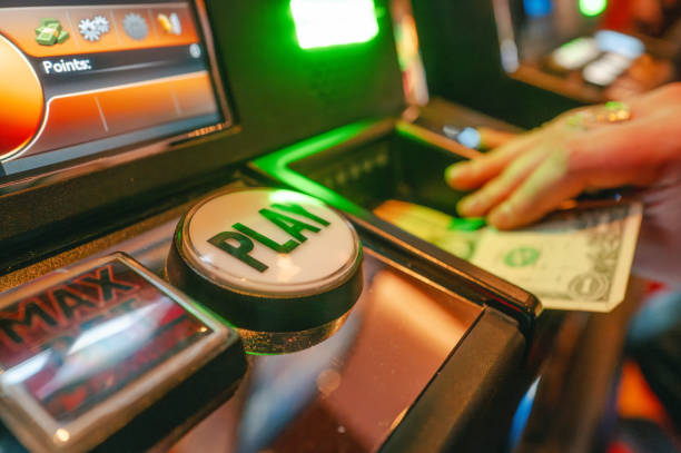 istock Casino Slot Machine - Play Button - Close Up - Hand 2189822562