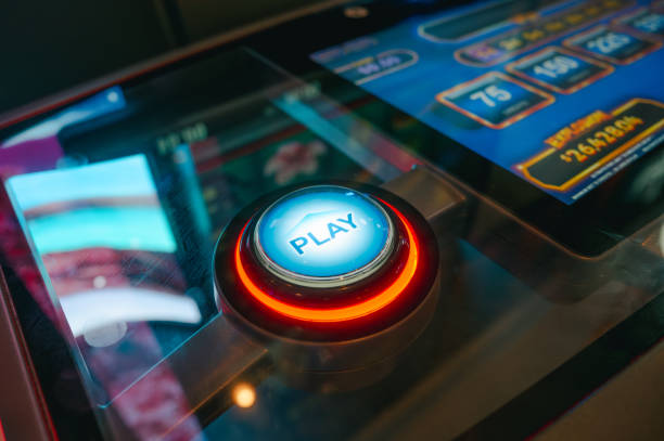 istock Casino Slot Machine - Play Button - Close Up - Red 2189822602