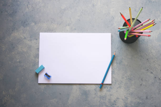 istock Blank paper, pencil, eraser and sharpener on gray background 2189825237