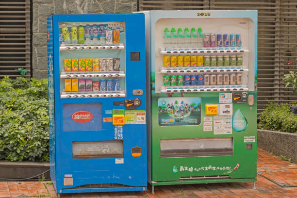 Narita, Chiba Prefecture, Japan: drinks and sweets vending machines, known as 'jidohanbaiki', a part of Japanese culture, a country that values convenience - Japan leads the world in vending machine per capita - Tokyo Narita International Airport (the machine on the left dispenses hot water).