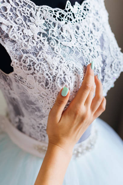 istock the bride's hand touches the lace. close up 2189836584