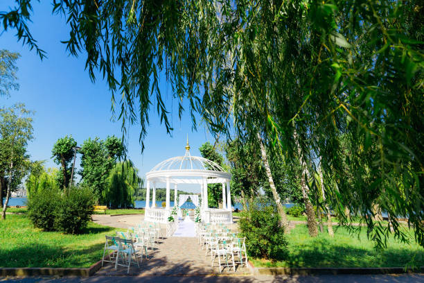 istock park with gazebo. Place for wedding ceremony. lake shore 2189836585