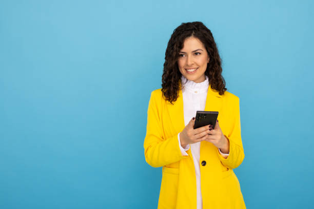 istock Confident Latina entrepreneur using a smartphone 2189836671