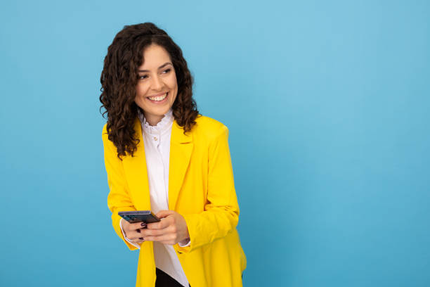 istock Ambitious Latina professional using her mobile phone 2189836940