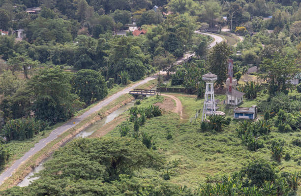 istock Canal and drainage system from Drainage Khun Dan Prakan Chon Dam with scenery cuts through lush green hills amidst landscape nature. 2189837510