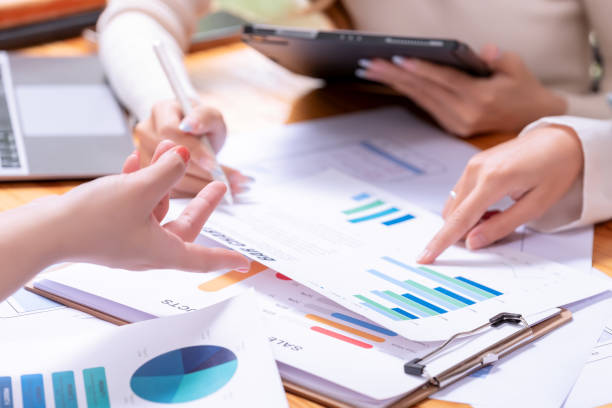 istock People's hands working with papers at meeting discussions shows successful teamwork. 2189840577