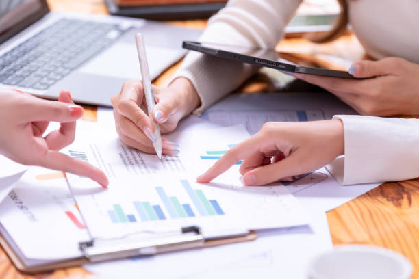 istock People's hands working with papers at meeting discussions shows successful teamwork. 2189840585