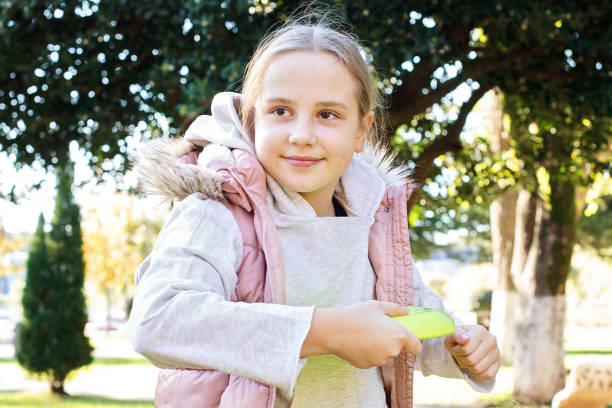 istock Child with flying disc in park outdoors portrait 2189848840