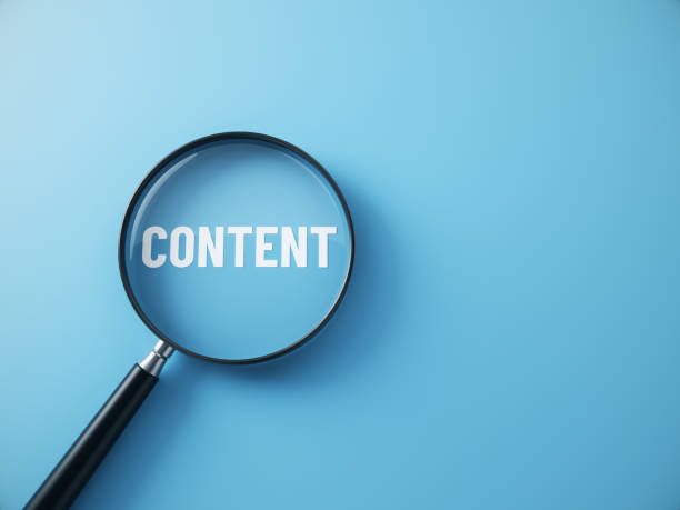 istock Magnifying glass with the word content written on blue background. Content and search concept. 2189850333