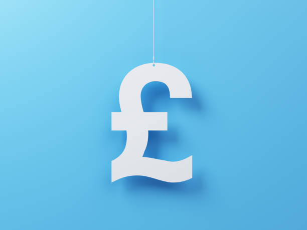 istock Pound symbol cut on white note paper hanging on string, White note paper on a blue background. 2189850398