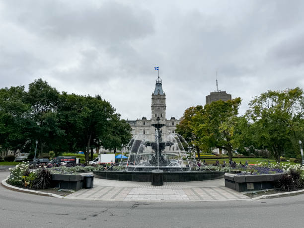 Quebec City, Canada - September 10, 2024: The fountain located in the center of Av Honoré-Mercier in front of the Parliament Building of Quebec.