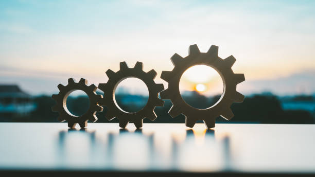 istock Gears from at blue urban and sunlight background. concept of a teamwork cooperation idea. 2189865652