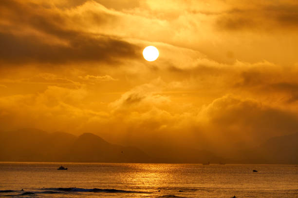 istock Scenic view of ocean agasint dramtic sky during sunrise 2189869987