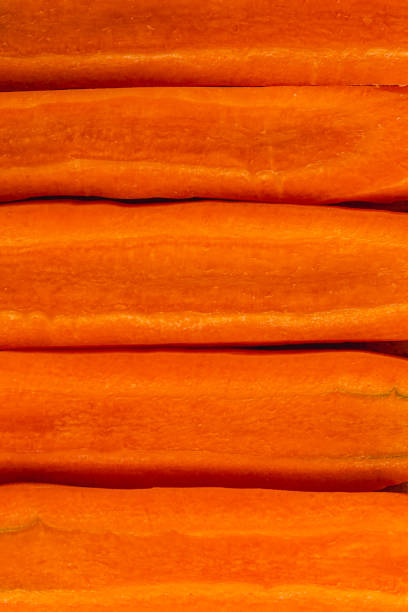 Cut carrots flat slice as background for healthy eating concept High quality photo.