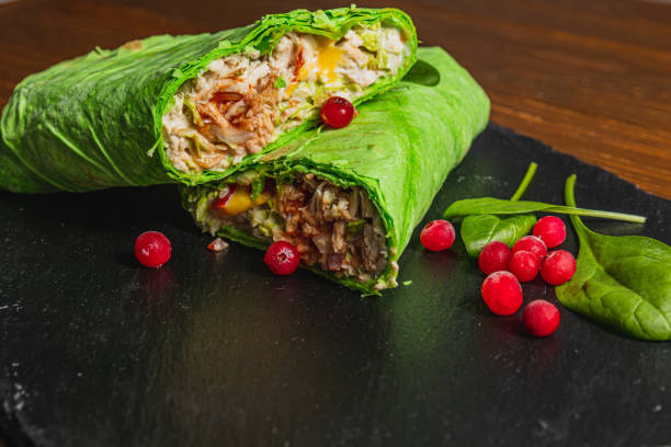 istock Homemade shawarma with spinach filled with chicken, vegetables and cranberries 2189872703