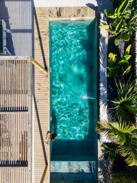 Modern backyard with swimming pool and entertaining area in Australian mansion