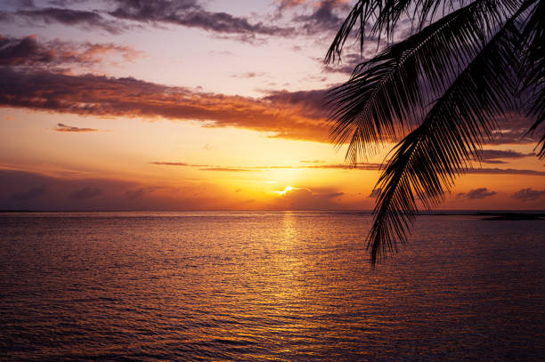 Rainy sunrise over calm water of Card Sound, Florida.