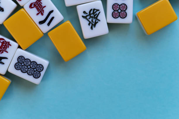 istock Mahjong tiles lined up on a blue background 2189883112