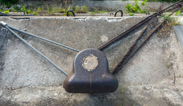 New and old wire ropes tyed to a mooring bollrd