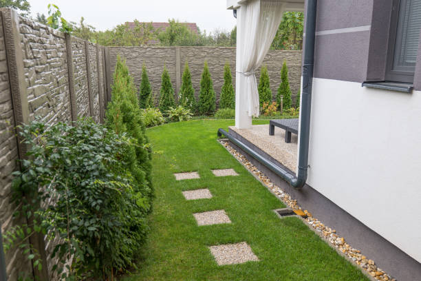 istock Gutter Downspout Placement into the garden. Rain water use in your house 2189887433
