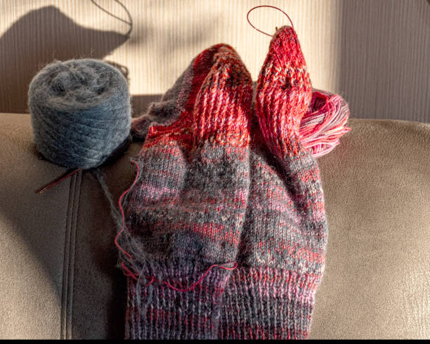 istock colorful knitted work in progress, handicraft concept, knit texture, wool handicrafts, hobby 2189893225