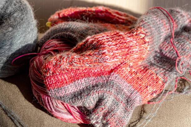istock colorful knitted work in progress, handicraft concept, knit texture, wool handicrafts, hobby 2189893235