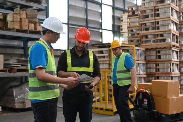 istock The Caucasian warehouse manager leader assignment a new employee, job, training for worker, and meeting before work 2189896704