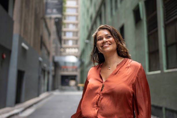 istock Smiling Multiracial Woman in a Modern Urban Setting 2189896957